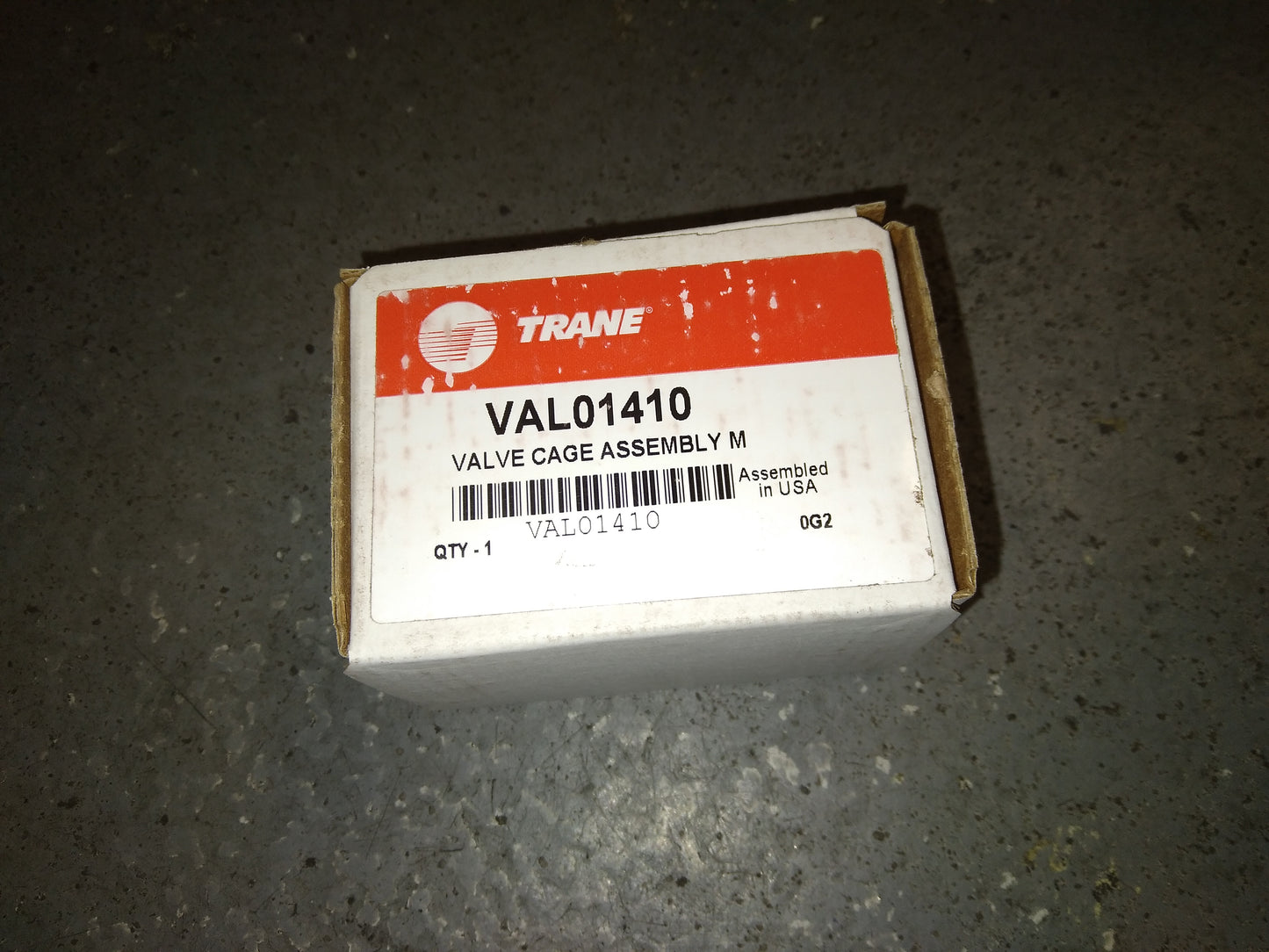 VALVE CAGE DISCHARGE ASSEMBLY