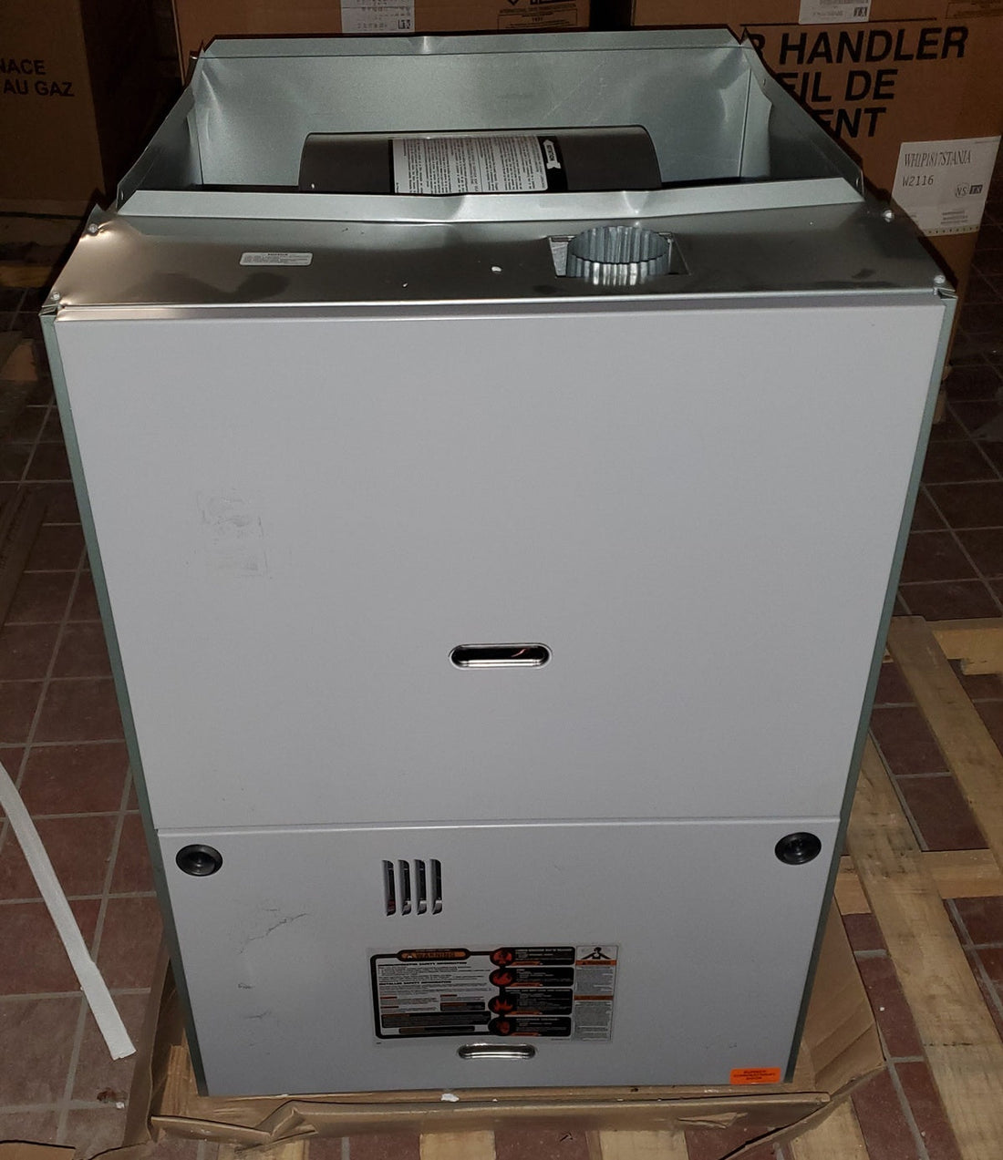 Affordable natural gas furnace unit showing front panel and exhaust opening, commonly used with replacement furnace parts and HVAC components