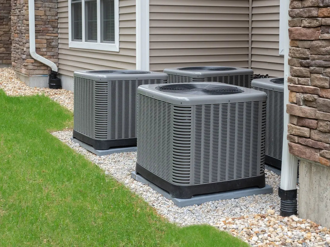 Residential HVAC system showing multiple AC condenser units used for home cooling
