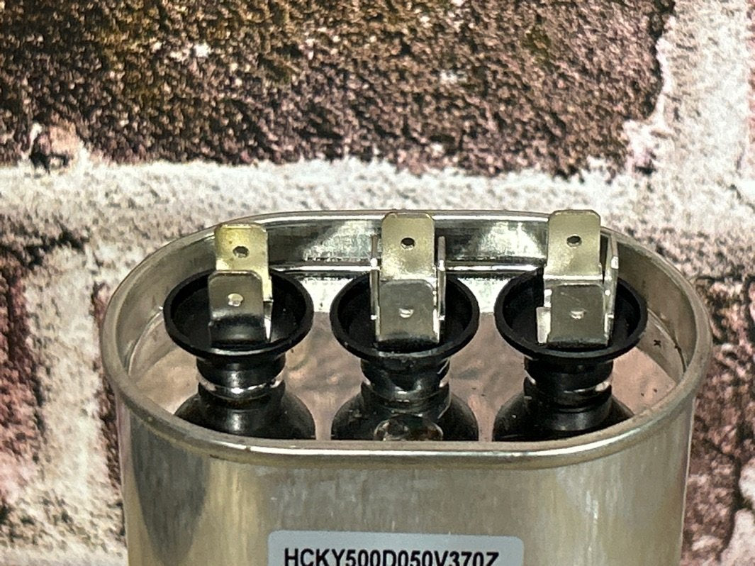 370 Vac, 50+5MFD 50/60 Hz, Oval Capacitor